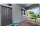 Charming front porch with brick pavers, an outdoor swing, and a neighborhood view at 16324 Brisk Breeze Aly, Winter Garden, FL 34787