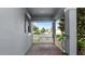 Charming front porch with brick pavers, an outdoor swing, and a neighborhood view at 16324 Brisk Breeze Aly, Winter Garden, FL 34787