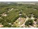 Beautiful wooded neighborhood with home and long drive nestled among the trees at 21590 Sw 84Th Loop, Dunnellon, FL 34431