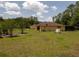 Spacious backyard with lush greenery and trees, perfect for outdoor enjoyment at 21590 Sw 84Th Loop, Dunnellon, FL 34431