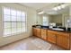 Bathroom with double sink vanity and large window providing natural light at 21590 Sw 84Th Loop, Dunnellon, FL 34431