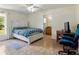 Bright bedroom with white accents, a ceiling fan, and an ensuite bathroom at 21590 Sw 84Th Loop, Dunnellon, FL 34431