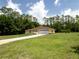 Well-maintained home with a two-car garage, large front yard, and mature trees at 21590 Sw 84Th Loop, Dunnellon, FL 34431