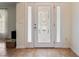 Beautiful front door with decorative glass, and tiled flooring in the foyer at 21590 Sw 84Th Loop, Dunnellon, FL 34431