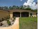 Charming walkway leading up to the porch, accompanied by a landscaped garden at 21590 Sw 84Th Loop, Dunnellon, FL 34431