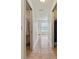 Hallway with tiled floors and walk-in closet access at 21590 Sw 84Th Loop, Dunnellon, FL 34431