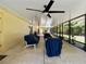 Enclosed Lanai featuring a ceiling fan and plenty of space for outdoor lounging at 21590 Sw 84Th Loop, Dunnellon, FL 34431