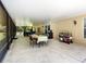 Screened lanai featuring an outdoor dining area and access to the backyard at 21590 Sw 84Th Loop, Dunnellon, FL 34431