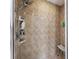 Tiled shower with detachable shower head and built-in shelves for toiletries at 21590 Sw 84Th Loop, Dunnellon, FL 34431