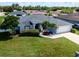 Beautiful home featuring a lush green lawn and mature landscaping at 2869 Hickory Ridge Dr, Lakeland, FL 33813