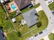 An aerial view of the property showcasing the layout of the home, backyard, and surroundings at 2869 Hickory Ridge Dr, Lakeland, FL 33813