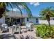 Rear patio area with ample seating and easy access to the home's interior through sliding glass doors at 2869 Hickory Ridge Dr, Lakeland, FL 33813