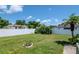 Spacious, well-maintained backyard enclosed by a white fence, perfect for outdoor activities and privacy at 2869 Hickory Ridge Dr, Lakeland, FL 33813