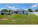 A well maintained lawn offers a patio, grill, and a fully fenced yard at 2869 Hickory Ridge Dr, Lakeland, FL 33813