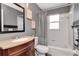 Bathroom features vanity sink, framed mirror, and shower and tub combo at 2869 Hickory Ridge Dr, Lakeland, FL 33813