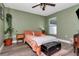 Bedroom with updated flooring, ceiling fan, and warm lighting at 2869 Hickory Ridge Dr, Lakeland, FL 33813