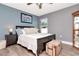 Bedroom with nice light features a ceiling fan and modern flooring at 2869 Hickory Ridge Dr, Lakeland, FL 33813