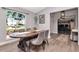Charming dining area features an oval table, stylish chairs, and natural light from a large arched window at 2869 Hickory Ridge Dr, Lakeland, FL 33813