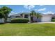 Beautiful home featuring a lush green lawn and mature landscaping at 2869 Hickory Ridge Dr, Lakeland, FL 33813