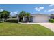 Charming home with a well-manicured lawn and inviting curb appeal at 2869 Hickory Ridge Dr, Lakeland, FL 33813