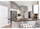 Bright kitchen featuring granite countertops, white cabinets, stainless steel appliances, and modern fixtures at 2869 Hickory Ridge Dr, Lakeland, FL 33813