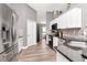 Bright kitchen featuring white cabinets, stainless steel appliances and granite countertops at 2869 Hickory Ridge Dr, Lakeland, FL 33813