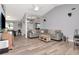 Expansive living room with high ceilings, wood-look flooring, comfortable seating, and an open layout at 2869 Hickory Ridge Dr, Lakeland, FL 33813