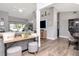 Open living area boasts wood-look floors, neutral paint, and sliding doors to the outdoor patio at 2869 Hickory Ridge Dr, Lakeland, FL 33813
