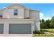 Charming two-story home featuring a two-car garage, beautiful landscaping and a welcoming red brick walkway at 584 Bay Leaf Dr, Poinciana, FL 34759