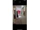 Hallway leading into the living room featuring carpet and decorated walls at 12385 Se 86Th Ave, Belleview, FL 34420