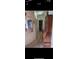 Hallway featuring carpet and decor leading to other rooms at 12385 Se 86Th Ave, Belleview, FL 34420
