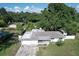This aerial view showcases the front yard and mature trees in this established neighborhood at 1818 Fredricksburg Ave, Lakeland, FL 33803