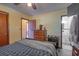 Bedroom featuring a queen bed, dresser, and adjoining bathroom at 1818 Fredricksburg Ave, Lakeland, FL 33803