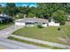 Single story home with a well maintained lawn and a two car garage at 1818 Fredricksburg Ave, Lakeland, FL 33803