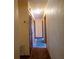 Hallway features neutral colored walls and trim, and multiple doors at 1818 Fredricksburg Ave, Lakeland, FL 33803