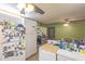 This kitchen area offers a fridge with lots of character, plus easy access to the living and dining areas at 1818 Fredricksburg Ave, Lakeland, FL 33803