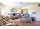 Comfortable living room offering cozy seating, soft carpeting, and a relaxed atmosphere at 1818 Fredricksburg Ave, Lakeland, FL 33803
