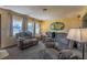 Cozy living room featuring comfortable seating, soft lighting, and a large windows at 1818 Fredricksburg Ave, Lakeland, FL 33803