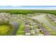 Aerial view of a vibrant community with beautiful landscaping, waterways, and well-maintained properties at 2175 Old Mining Rd, Lakeland, FL 33801