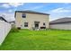 Large backyard with patio space for outdoor entertaining and lush green grass at 2175 Old Mining Rd, Lakeland, FL 33801