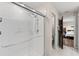 Bright bathroom featuring a tiled shower with sliding glass doors and updated fixtures at 2175 Old Mining Rd, Lakeland, FL 33801