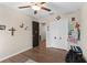 Neutral bedroom offering wood-look floors, a ceiling fan and a large closet space at 2175 Old Mining Rd, Lakeland, FL 33801
