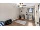 Bright bedroom showcasing hardwood floors, a ceiling fan and plenty of natural light at 2175 Old Mining Rd, Lakeland, FL 33801