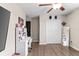 Neutral bedroom boasts wood-look floors, a ceiling fan and desk area with great lighting at 2175 Old Mining Rd, Lakeland, FL 33801