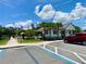 Community clubhouse featuring beachy colors, palm trees and a relaxing area for residents to enjoy at 2175 Old Mining Rd, Lakeland, FL 33801