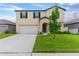 Charming two-story home with a manicured lawn and inviting curb appeal at 2175 Old Mining Rd, Lakeland, FL 33801