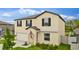 Two-story home showcasing black shutters, well-kept lawn, and inviting curb appeal at 2175 Old Mining Rd, Lakeland, FL 33801