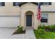 Inviting front entrance with a dark blue door and a charming American flag at 2175 Old Mining Rd, Lakeland, FL 33801