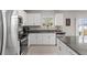 Beautiful kitchen featuring stainless steel appliances, granite countertops, and modern cabinetry at 2175 Old Mining Rd, Lakeland, FL 33801
