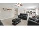 Open-concept living area with tile flooring and seamlessly connected kitchen at 2175 Old Mining Rd, Lakeland, FL 33801